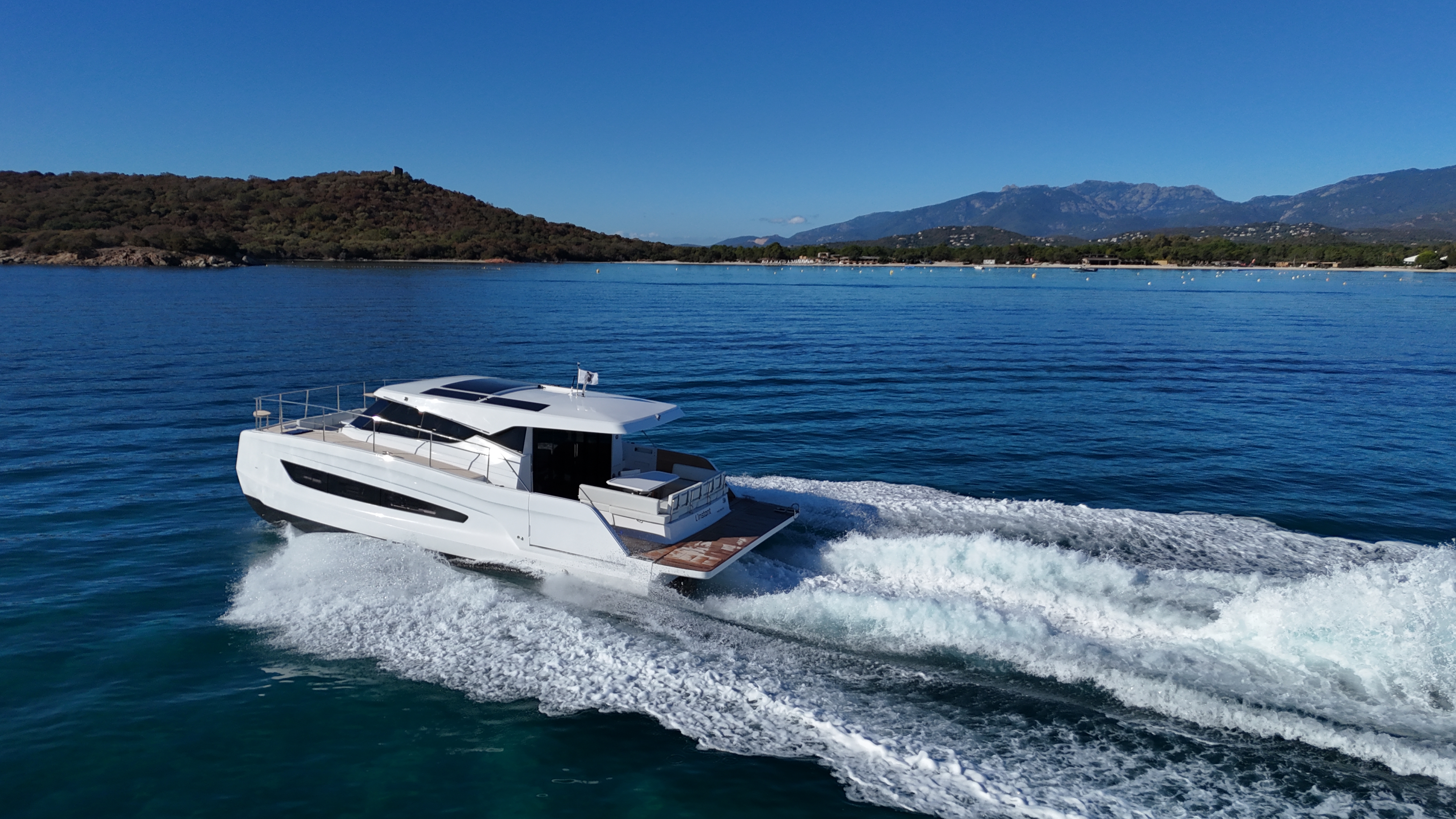 Elegant catamaran sailing at sunset along the Athens Riviera